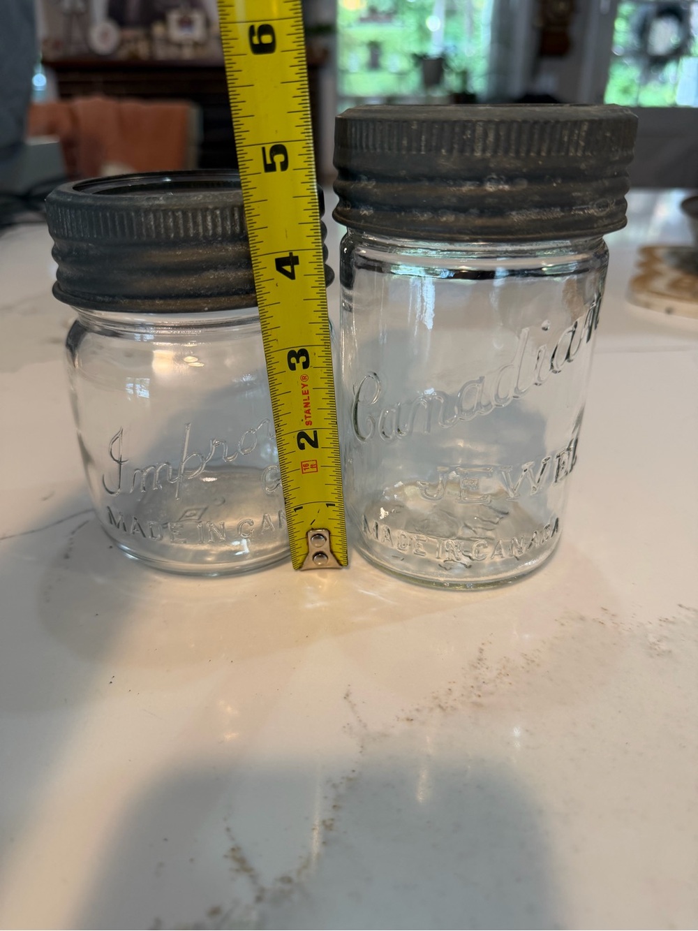 Antique glass jars with glass lid and metal bands